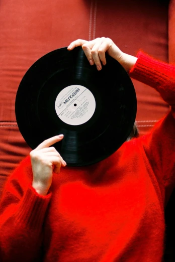a person holding a record in front of their face, by Doug Ohlson, visual art, soft vinyl, jacqueline e, large)}], premium quality
