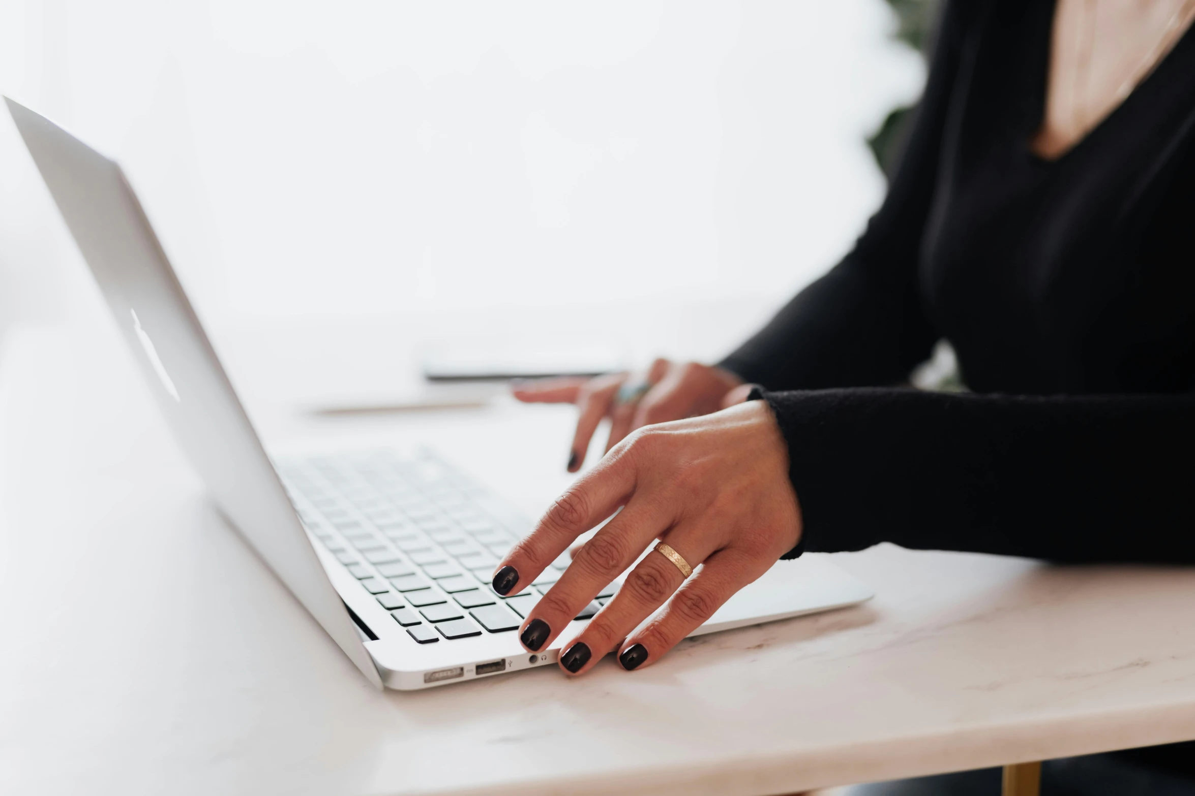 a close up of a person typing on a laptop, by Carey Morris, trending on pexels, wearing two metallic rings, female in office dress, avatar for website, white backround