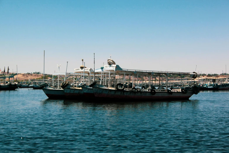 a boat that is sitting in the water, hurufiyya, moored, commercially ready, demna gvasalia, thumbnail