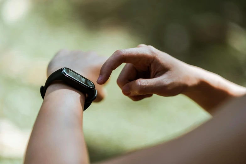 a close up of a person holding a smart watch, lush surroundings, profile image, arms out, thumbnail