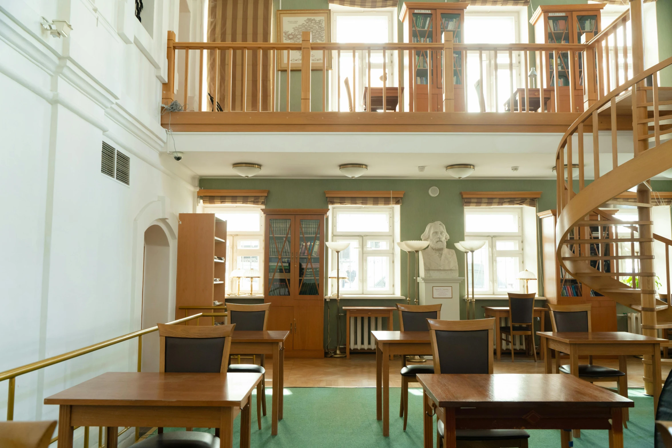 a room filled with lots of wooden tables and chairs, by Constantin Hansen, unsplash, danube school, russian neoclassicism, small library, reykjavik junior college, listing image