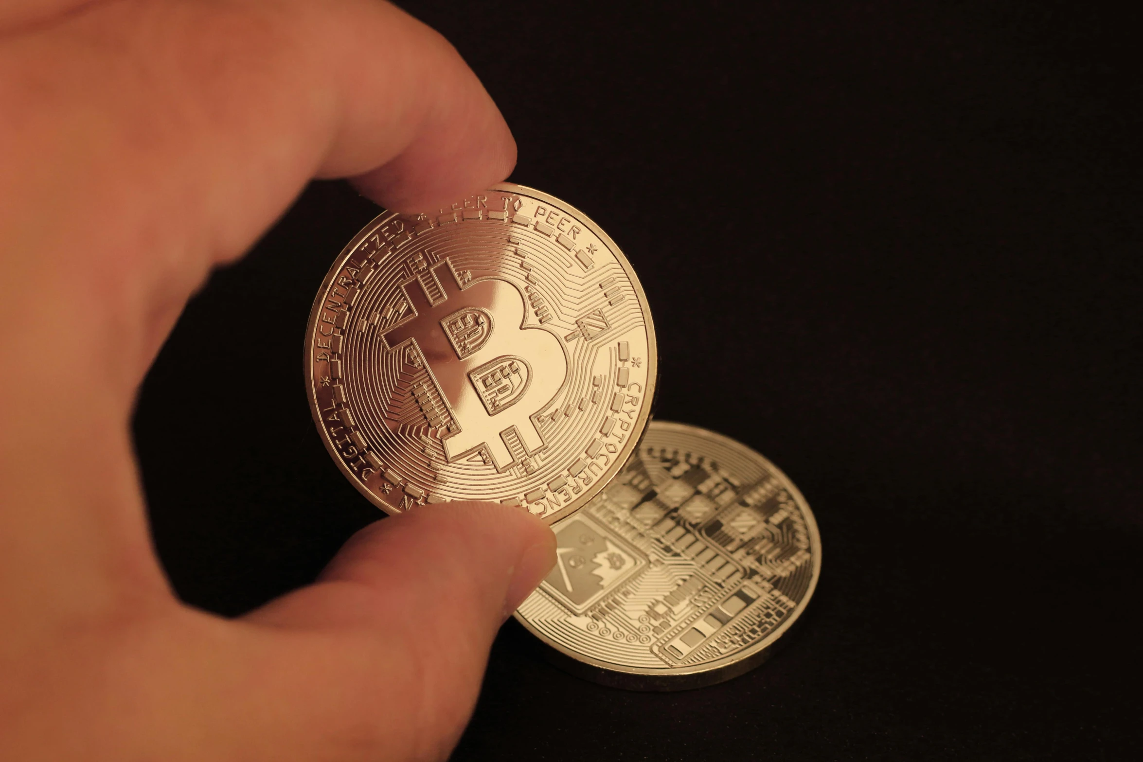 a person holding a bit coin in their hand, taken with canon 8 0 d, a pair of ribbed, high quality image, thumbnail