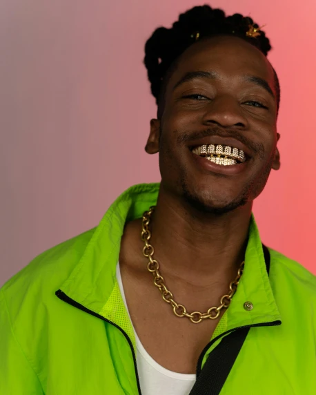 a close up of a person wearing a green jacket, an album cover, inspired by Xanthus Russell Smith, trending on pexels, smiling laughing, queer, day-glo colors, wearing a gold chain