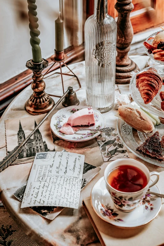 a table topped with plates of food and cups of tea, inspired by Eugène Isabey, pexels contest winner, ellen von unwerth, character sheets on table, bakery, normandy