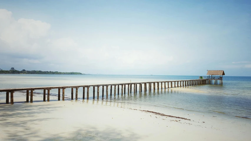 a pier in the middle of a body of water, an album cover, inspired by Thomas Struth, unsplash, minimalism, malaysian, beaching, cambodia, medium format