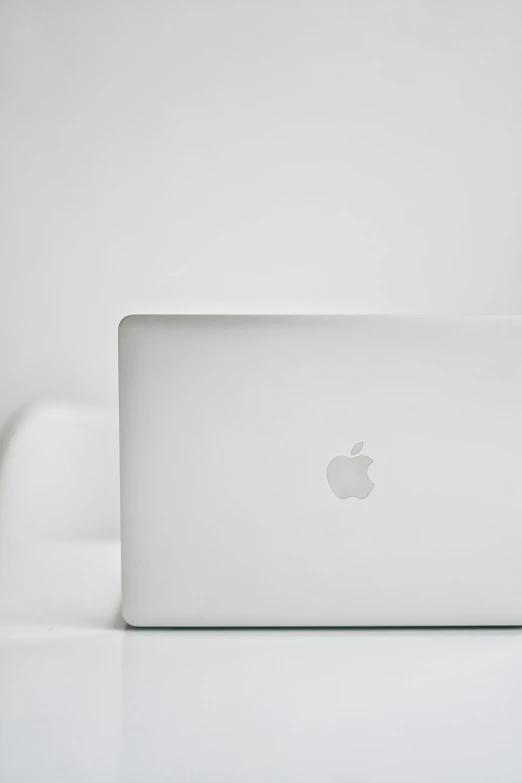 a white laptop computer sitting on top of a white table, by Gavin Hamilton, mint, 2 5 6 x 2 5 6 pixels, apple, up close image