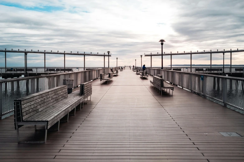 a couple of benches sitting on top of a wooden pier, pexels contest winner, new york city, infinitely long corridors, manly, grey