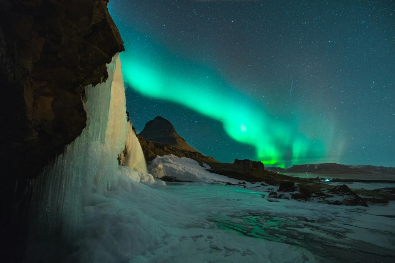 the aurora bore lights up the sky above a frozen waterfall, pexels contest winner, surrealism, thumbnail, 8 k 4 k, peaks, 2022 photograph