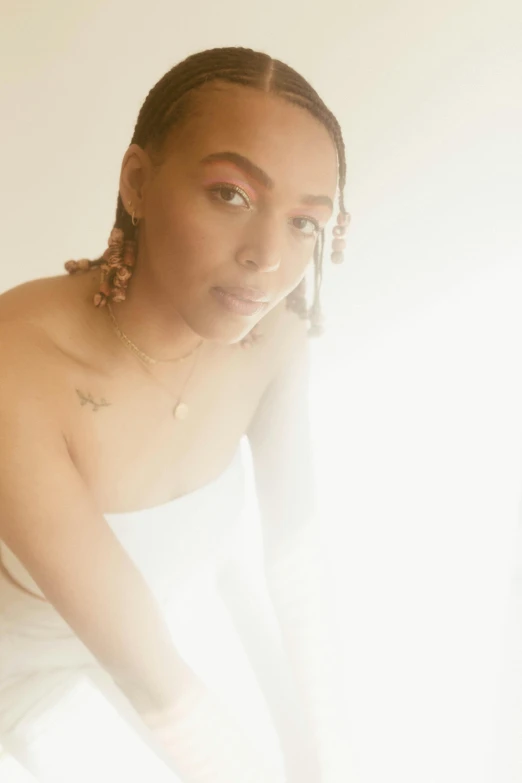 a woman sitting on top of a bed next to a window, by Dulah Marie Evans, doja cat, high key lighting, with the sun shining on it, confident looking