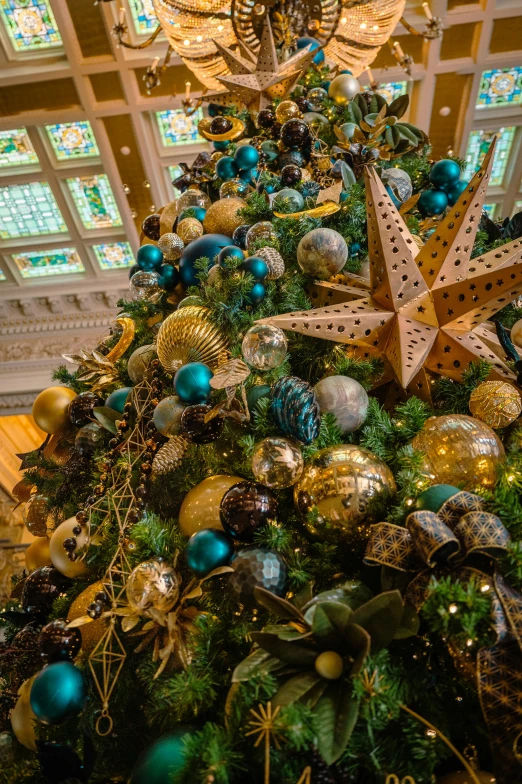 a christmas tree decorated with blue and gold ornaments, pexels, honeycomb halls, hdr detail, smithsonian, a long-shot from front
