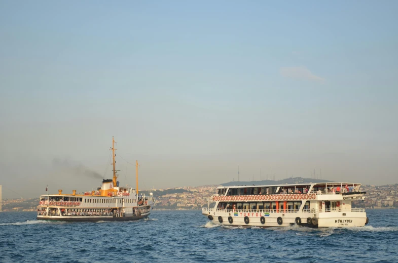 a couple of boats that are in the water, by Yasar Vurdem, pexels contest winner, hurufiyya, fallout style istanbul, 256x256, water surrounds the ship, thumbnail