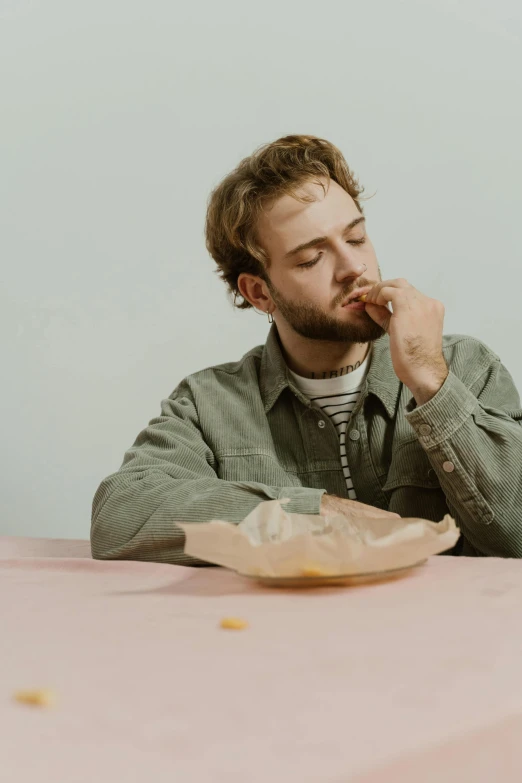 a man sitting at a table eating food, an album cover, trending on pexels, tired expression, russell dauterman, on a pale background, thoughtful pose