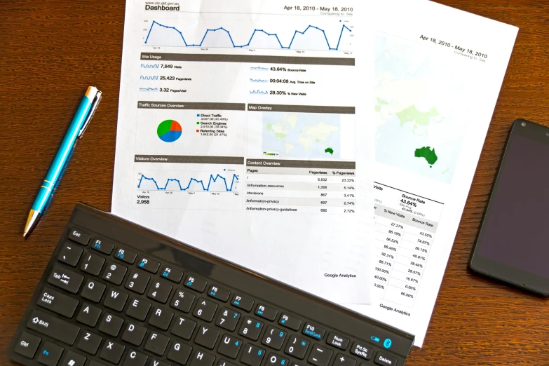 a laptop computer sitting on top of a wooden desk, analytical art, informative graphs and diagrams, thumbnail, commercial, view