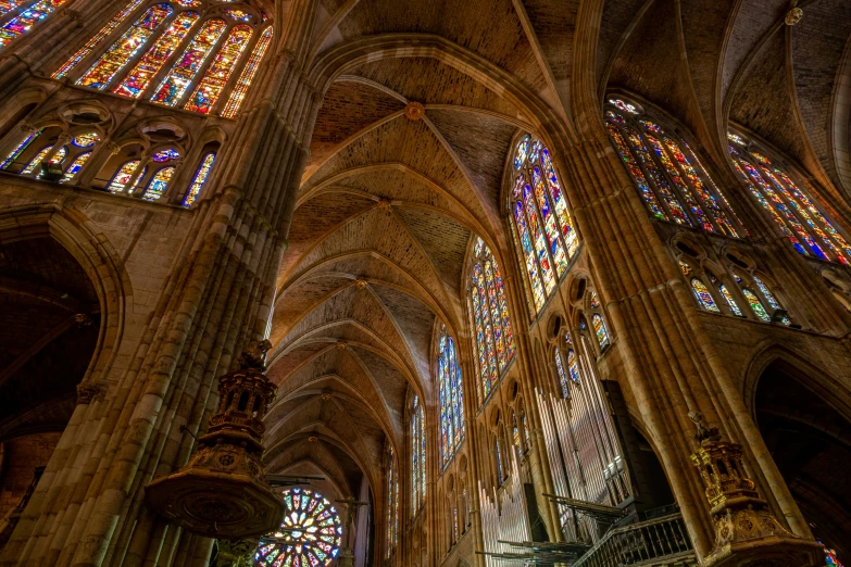 the inside of a cathedral with stained glass windows, a photo, by Luis Paret y Alcazar, renaissance, thumbnail, gigapixel photo, multiple stories, gothic art style