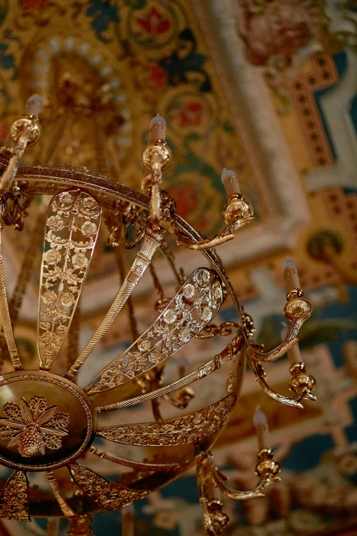 a close up of a chandelier in a room, inspired by Károly Markó the Elder, ornate gilded medieval icon, ornate dining hall, intricate oil details