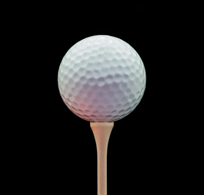 a golf ball on a tee on a black background, a digital rendering, unsplash, photorealism, 15081959 21121991 01012000 4k, hyper - detailed photo, instagram photo, cane