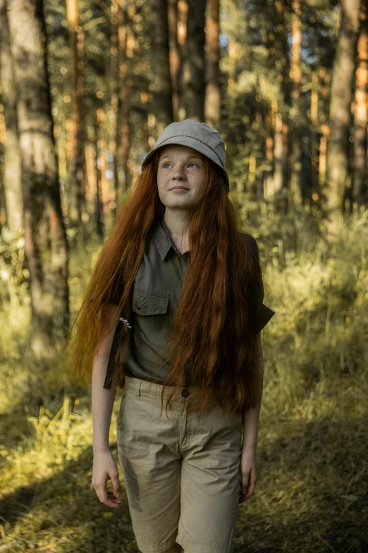 a woman with long red hair standing in the woods, girl wearing uniform, australian bush, greta thunberg, real life size