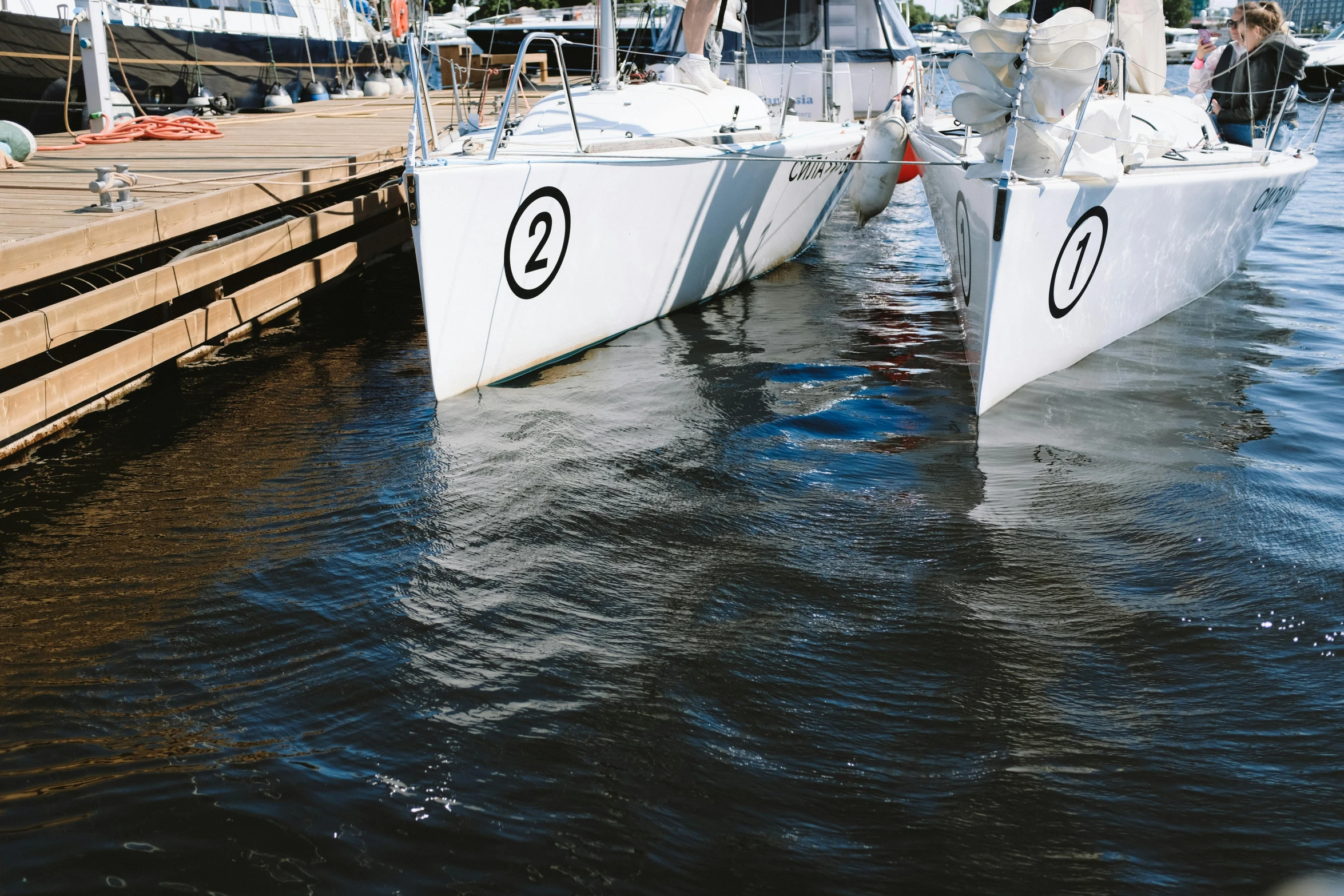 a couple of boats that are sitting in the water, profile image, white cyc, up close picture, thumbnail