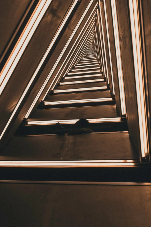 a very tall building with a lot of lights on it, inspired by Alexander Rodchenko, pexels contest winner, light and space, corridor, lying on an abstract, small steps leading down, metallic architecture