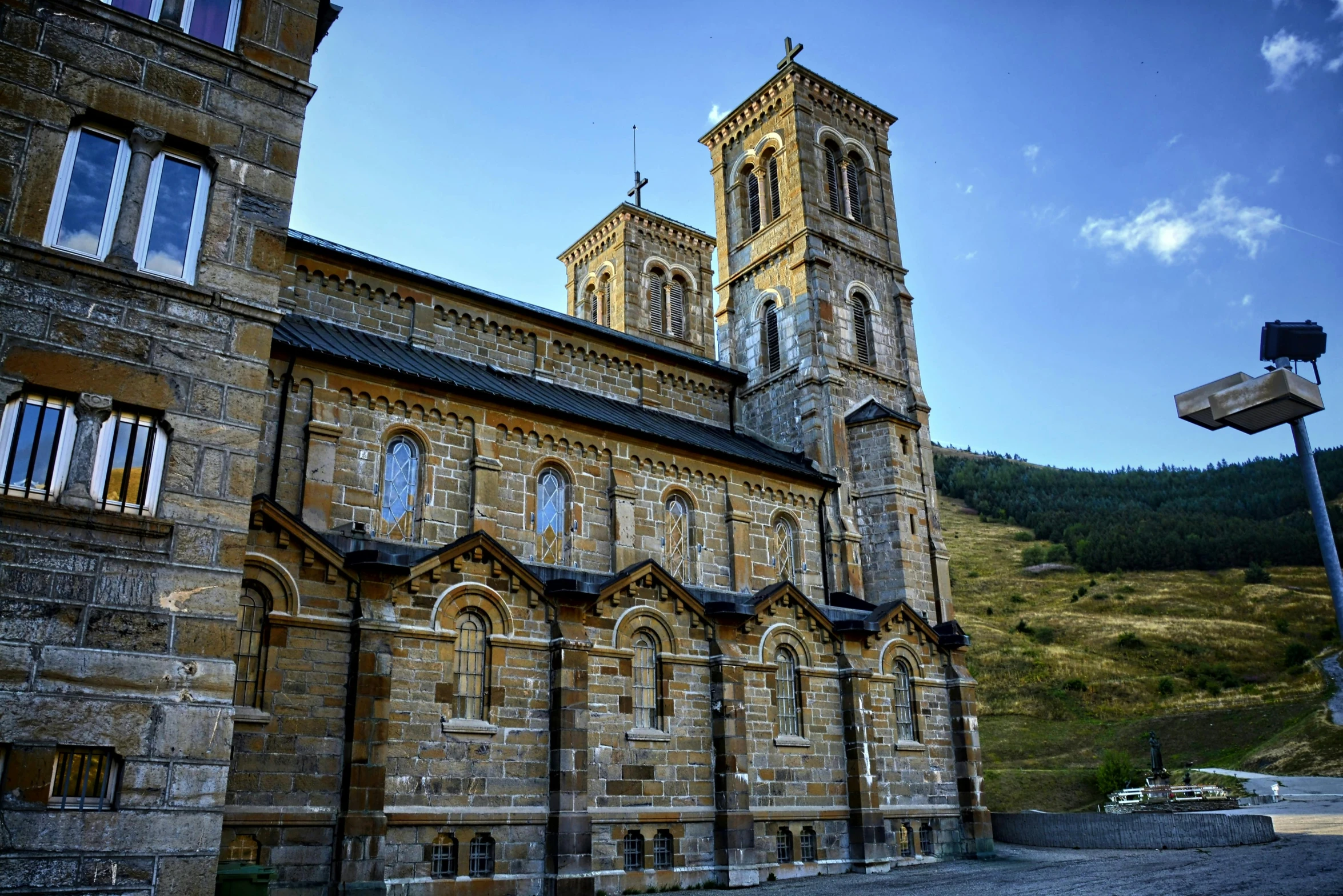 a large stone building with a clock tower, pexels contest winner, romanesque, alpine architecture, holy iconography, square, profile image