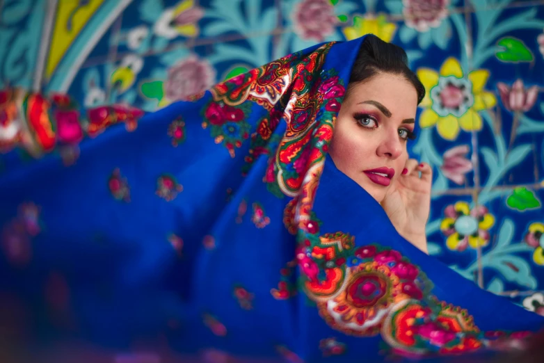 a woman with a blue scarf covering her face, pexels contest winner, qajar art, dressed in colorful silk, 5 0 0 px models, youtube thumbnail, fabric embroidery