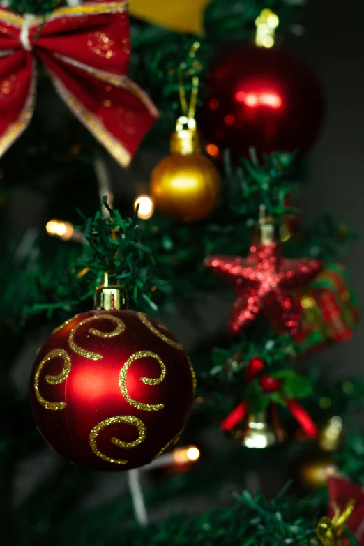 a close up of a christmas tree with ornaments, inspired by Ernest William Christmas, pexels, baroque, zoomed in, hi-res, uplit, teenager