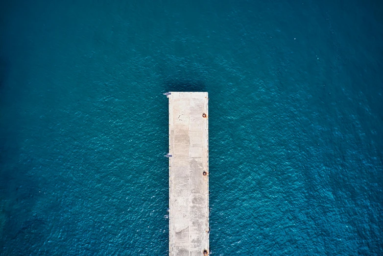 an aerial view of a pier in the middle of the ocean, by Jan Rustem, azure blue water, mina petrovic, gaze down, color ( sony a 7 r iv