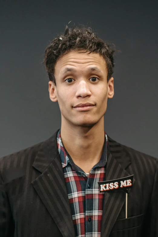 a close up of a person wearing a jacket, featured on reddit, kiss mouth to mouth, mixed race, paulie shore, studio photo