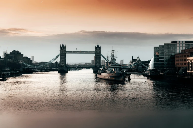 a large body of water with a bridge in the background, pexels contest winner, thames river, warships, thumbnail, faded glow