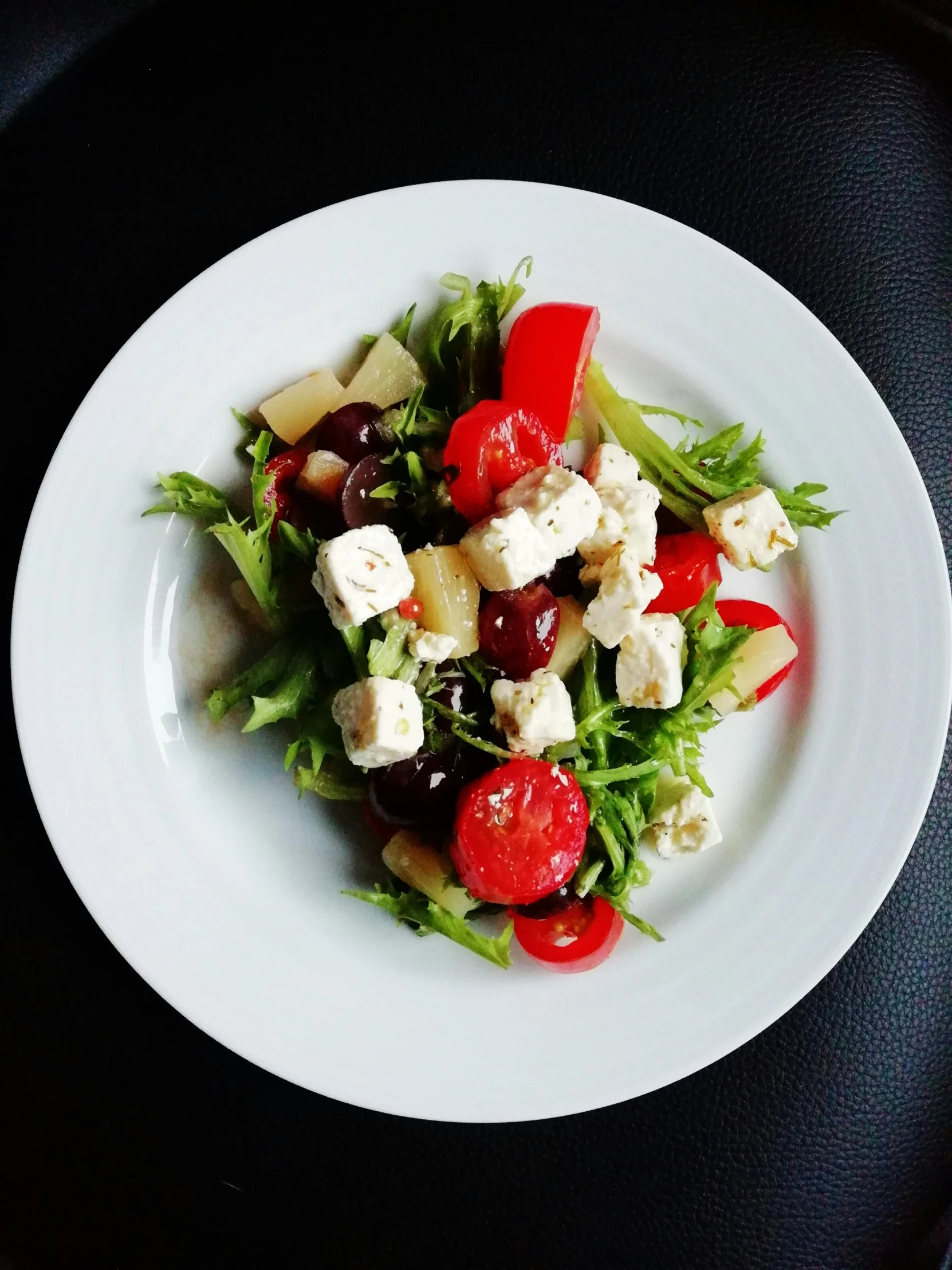 a white plate topped with a salad on top of a table, profile image, greece, fruit, slide show