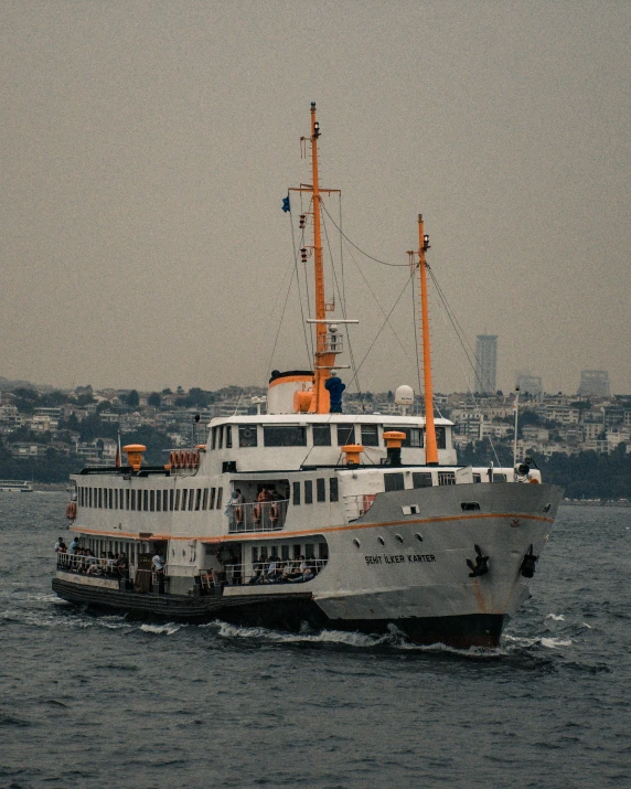 a large white boat traveling across a body of water, a colorized photo, by irakli nadar, pexels contest winner, hurufiyya, instagram story, lgbtq, istanbul, on ship