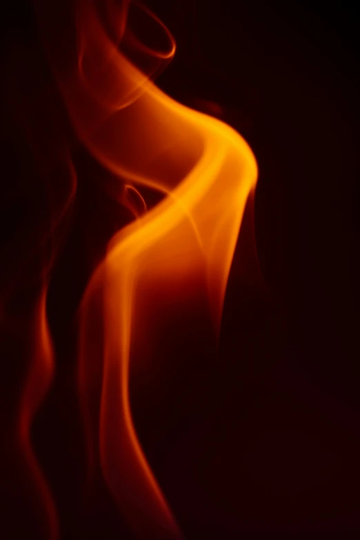 a close up of a fire on a black background, pexels, swoosh, red haze, tall, flare