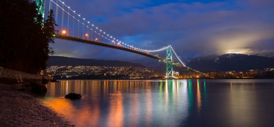 a bridge over a body of water at night, pexels contest winner, vancouver, 2 5 6 x 2 5 6 pixels, a colorful, website banner