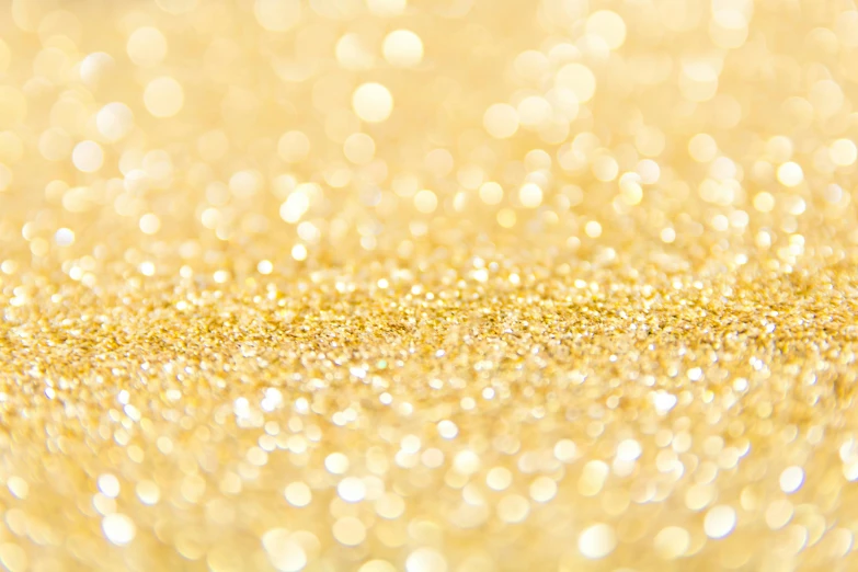 a close up of a gold glitter background, a microscopic photo, by Adam Marczyński, pixabay, pointillism, yellow carpeted, tiffany dover, happy birthday, white sparkles sunlight beams