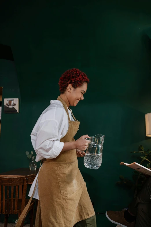 a woman standing next to a man holding a glass of water, pexels contest winner, renaissance, white apron, aussie baristas, copper and deep teal mood, ashteroth
