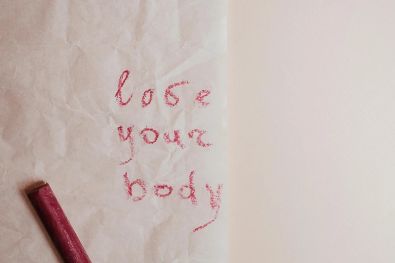 a close up of a piece of paper with writing on it, inspired by Tracey Emin, trending on pexels, cottagecore!! fitness body, pink body, human bodies, voge photo