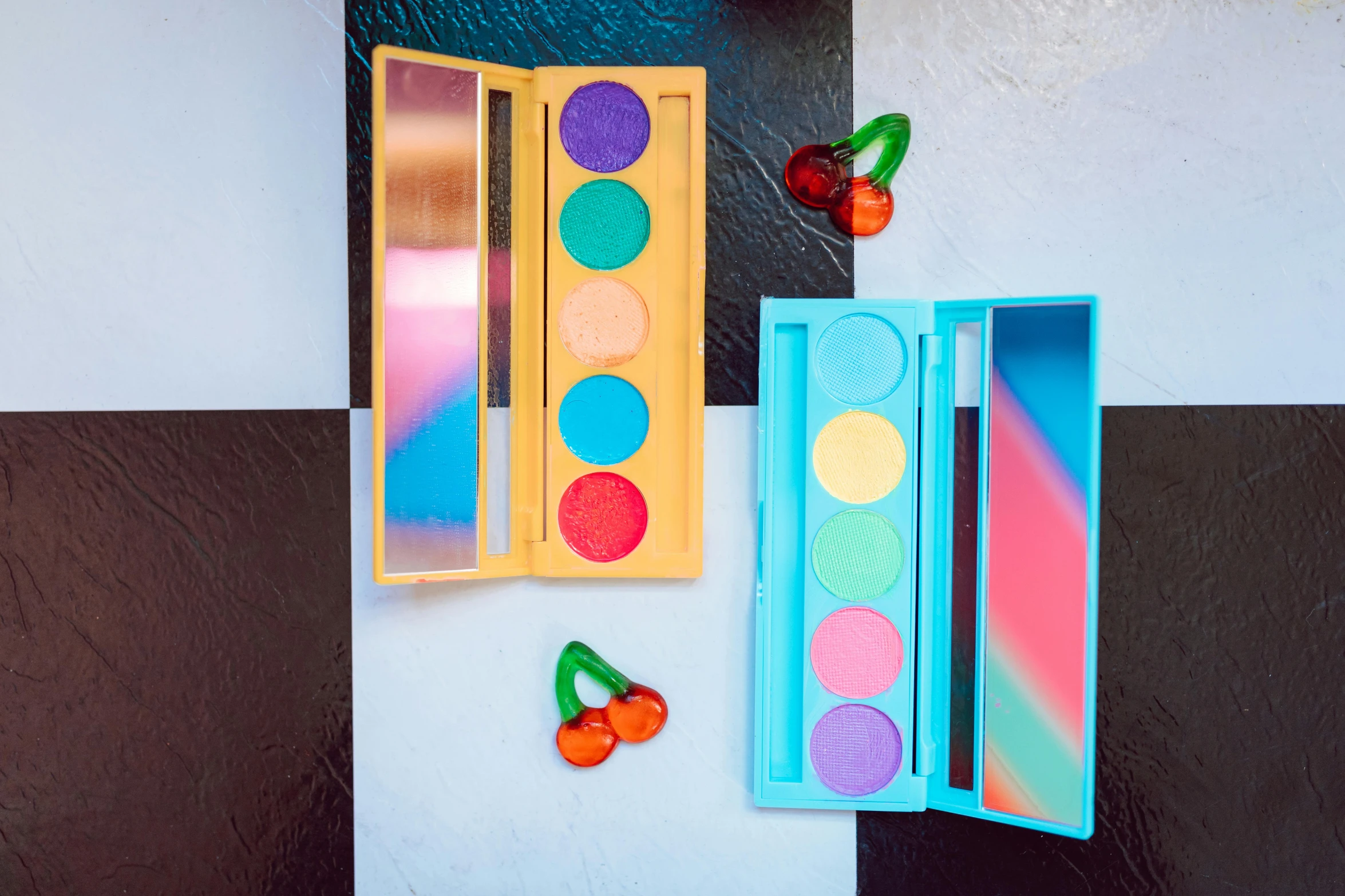 a close up of a mirror on a wall, an album cover, inspired by Okuda Gensō, trending on pexels, eyeshadow, turquoise palette, juicy color, detailed product image