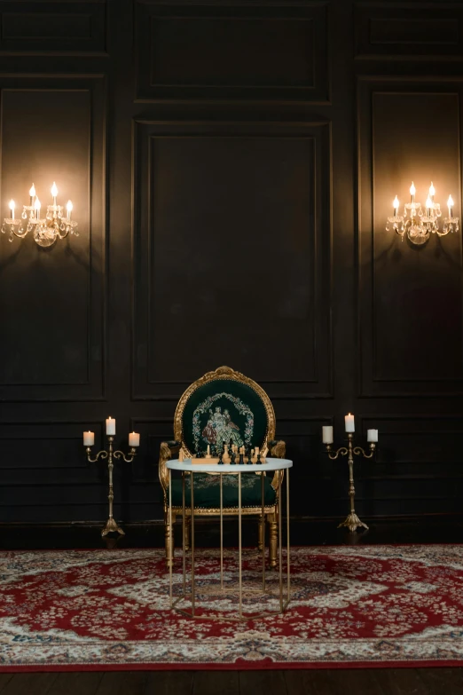 a table with candles and a chair in a room, a portrait, unsplash contest winner, baroque, gaming table, with crown, high quality photo, black backdrop