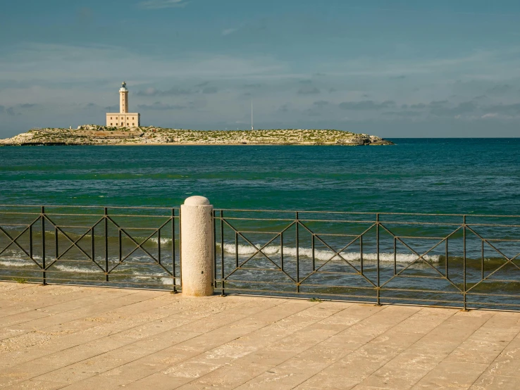 a large body of water with a lighthouse in the background, inspired by Fede Galizia, pexels contest winner, les nabis, square, alvaro siza, conversano, brown