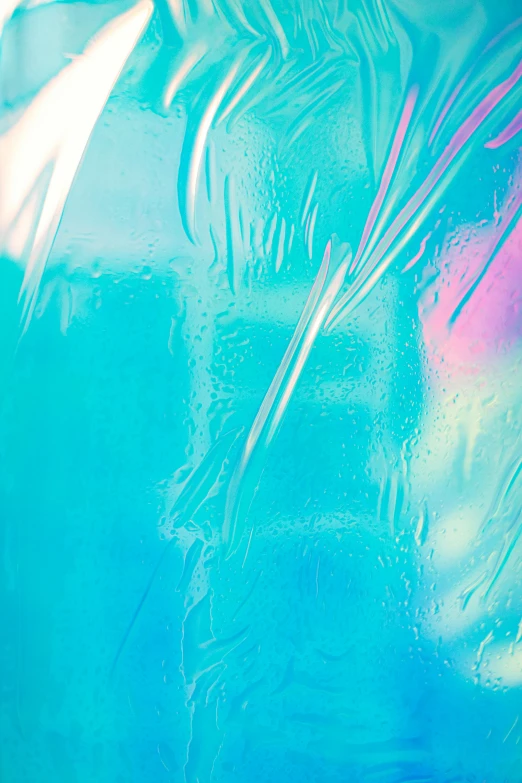 a blue vase sitting on top of a table, an album cover, inspired by Elsa Bleda, trending on pexels, lyrical abstraction, iridescent soapy bubbles, colourful close up shot, cracked plastic wrap, vibrant neon pastel