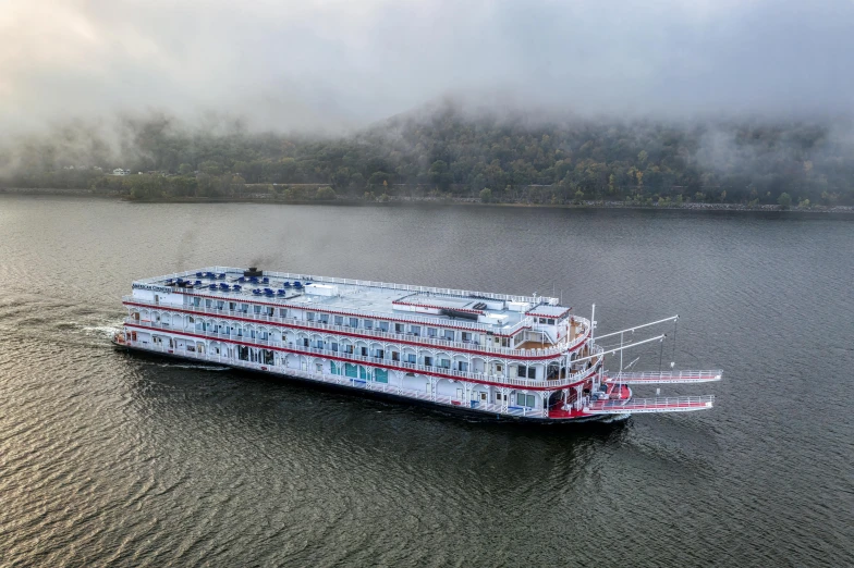 a large boat floating on top of a body of water, in louisiana, indian empress, maroon mist, ariel view