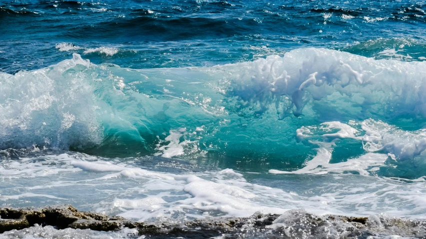 a person riding a surfboard on top of a wave, pexels contest winner, azure waves of water, glistening seafoam, ( ( ( kauai ) ) ), looking threatening