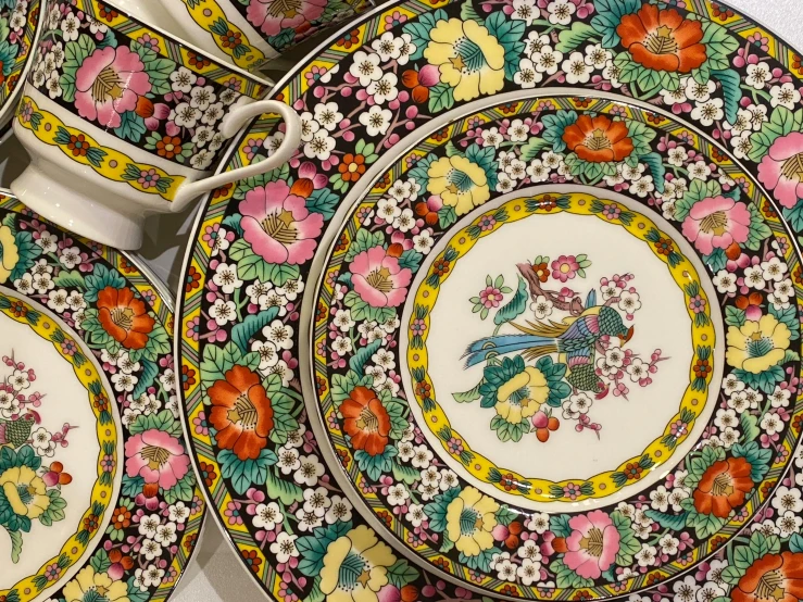 a bunch of plates sitting on top of a table, flickr, cloisonnism, 🌸 🌼 💮, regency-era, a brightly coloured, slide show