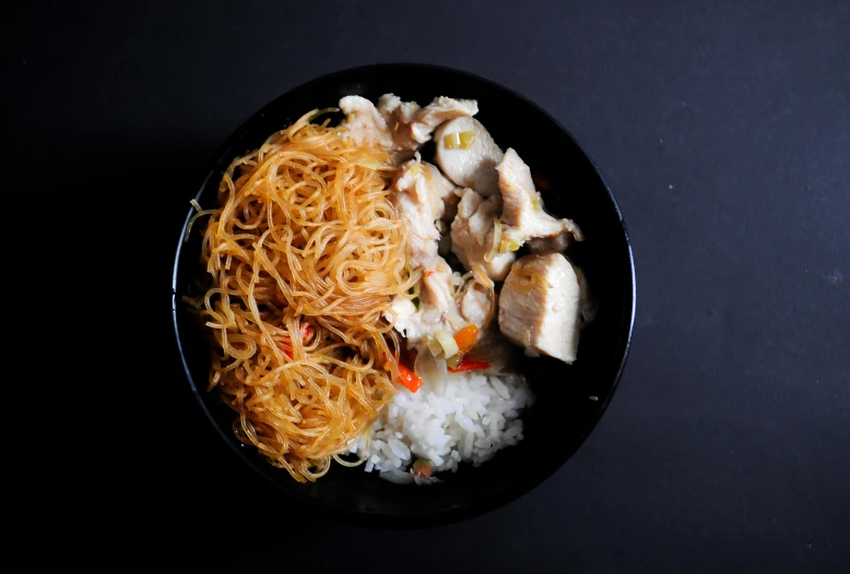 a black bowl filled with noodles and meat, a portrait, pexels, ((fish eye)), rice paper texture, square, rooster