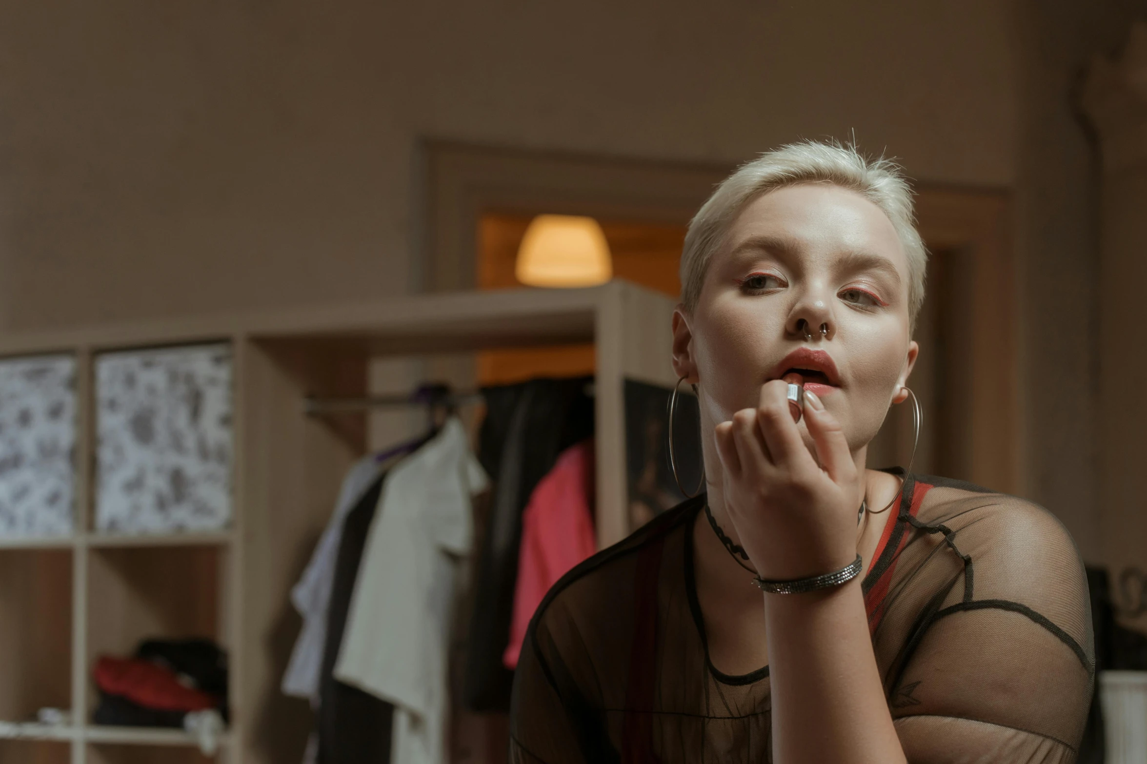 a woman brushing her teeth in front of a mirror, inspired by Elsa Bleda, pexels contest winner, photorealism, girl with short white hair, lipstick, betty cooper, eleven/millie bobbie brown