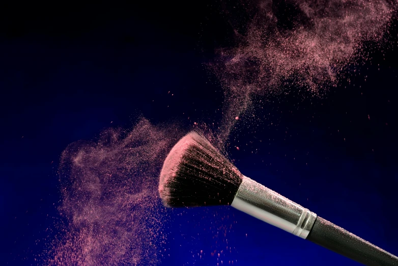 a makeup brush is sprinkled with pink powder, by Paul Bird, pexels contest winner, light red and deep blue mood, product render, conor walton, upscaled to high resolution