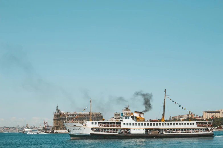 a large boat floating on top of a body of water, pexels contest winner, hurufiyya, a steam wheeler from 1880s, viewed from the harbor, high quality product image”, istanbul