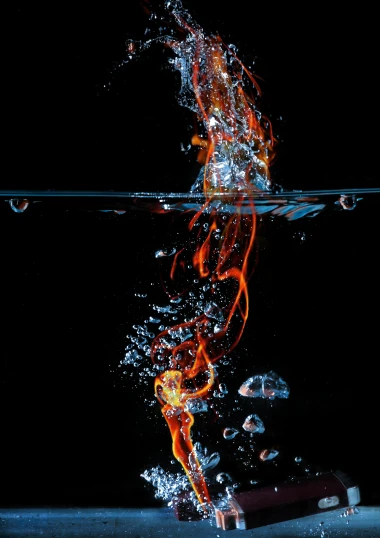 a glass of water with fire coming out of it, by Micha Klein, art photography, water line surface, medium long shot, underwater, avatar image