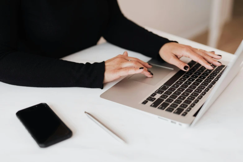 a close up of a person typing on a laptop, by Carey Morris, trending on pexels, on a white table, avatar image, background image, professional image