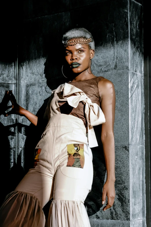 a black and white photo of a woman in a dress, inspired by Jean Micheal Basquiat, featured on instagram, afrofuturism, intricate leather suspenders, pastel', artist wearing torn overalls, with brown skin